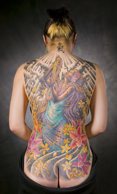 sexy girl with japanese tattoo on back body, full tattoo on the body, flower tattoo on lower back tattoo, butterfly tattoo on arm and flower tattoo 